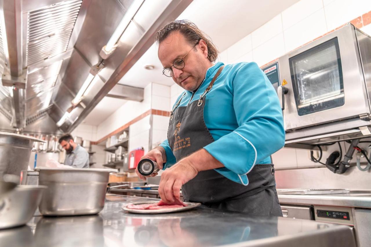 Hotel-Restaurant Erbprinz Ettlingen Exteriör bild Chef preparing a dish